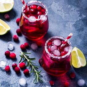 Two Glasses of Happy Holidays Punch Picture with cranberries and lime
