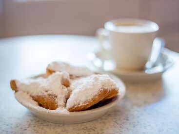 Beignets with powdered sugar & coffee