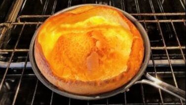 Dutch Baby Pancake in pan in oven