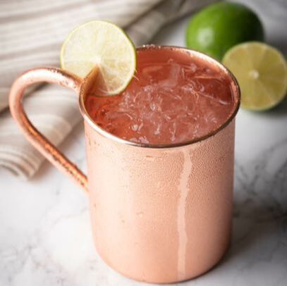 Copper ice-filled mug with lime