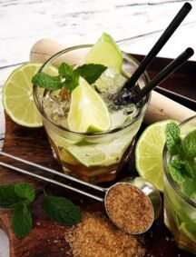 Caipirinha Cocktail with sugar, lime & muddler