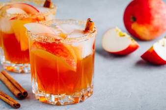 Fall Cocktail with apples & cinnamon sticks