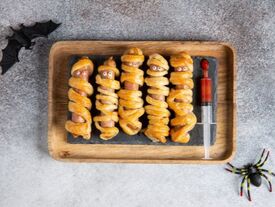 Tray of hot dogs wrapped in dough 