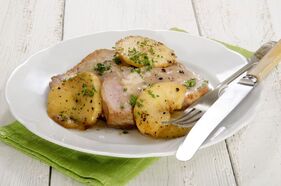 French Apple Pork Chops with Apples on a plate