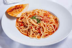 Bowl of Spaghetti with garlic bread